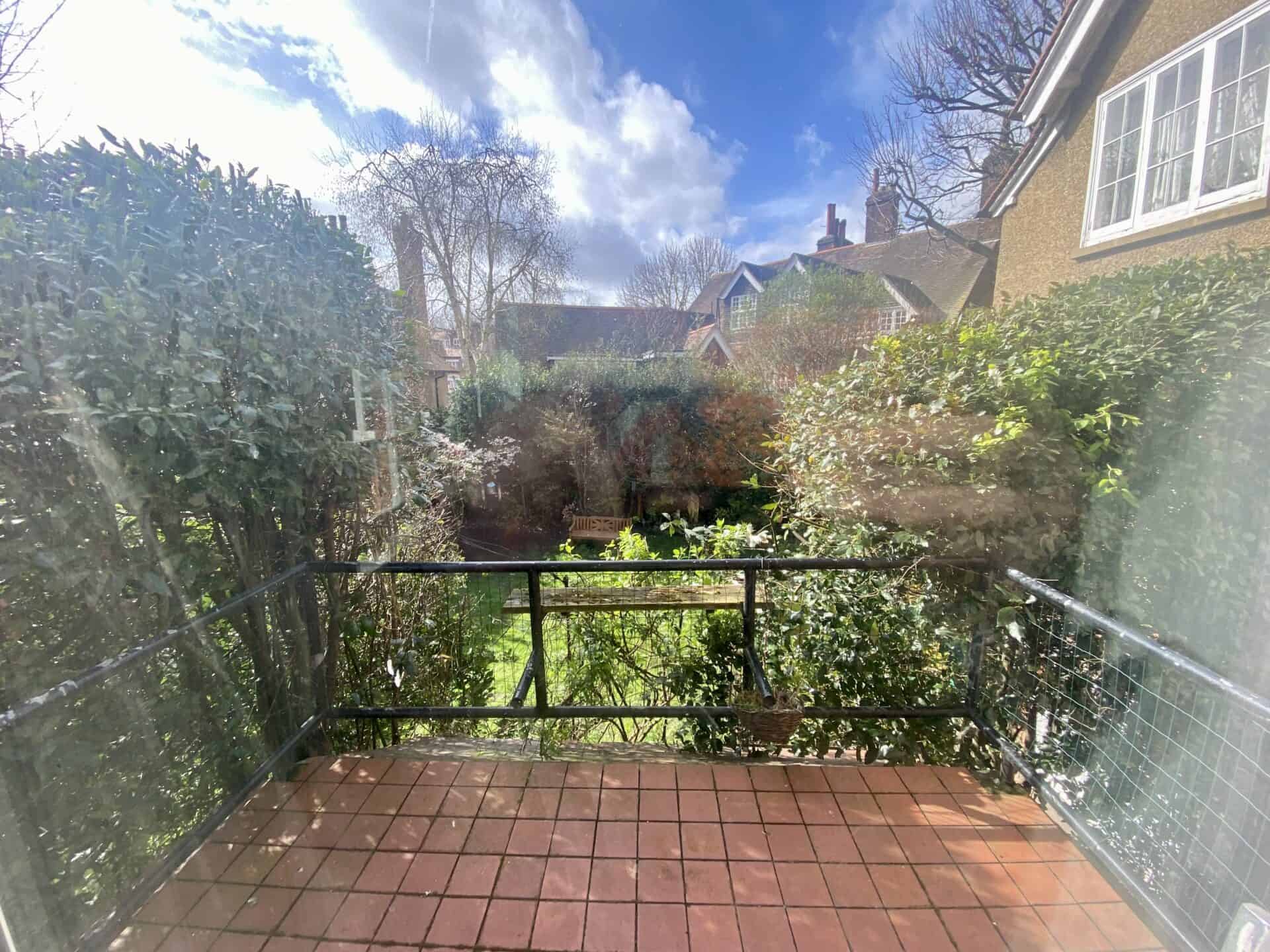 balcony overlooking ground floor garden